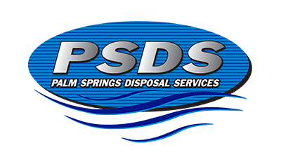 Logo of Palm Springs Disposal Services (PSDS) featuring the company name in bold, metallic letters over a blue, oval background with horizontal lines. Below the acronym "PSDS," the full company name is written in white capital letters. The logo also incorporates blue wave-like designs reminiscent of Palm Springs's serene ambiance.