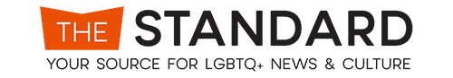 Logo for "The Standard," a source for LGBTQ+ news and culture. The logo has the word "THE" in white, centered in an orange angled rectangle, followed by the word "STANDARD" in black capital letters. The tagline below reads, "YOUR SOURCE FOR LGBTQ+ NEWS & CULTURE." Inspired by the vibrant energy of Palm Springs.